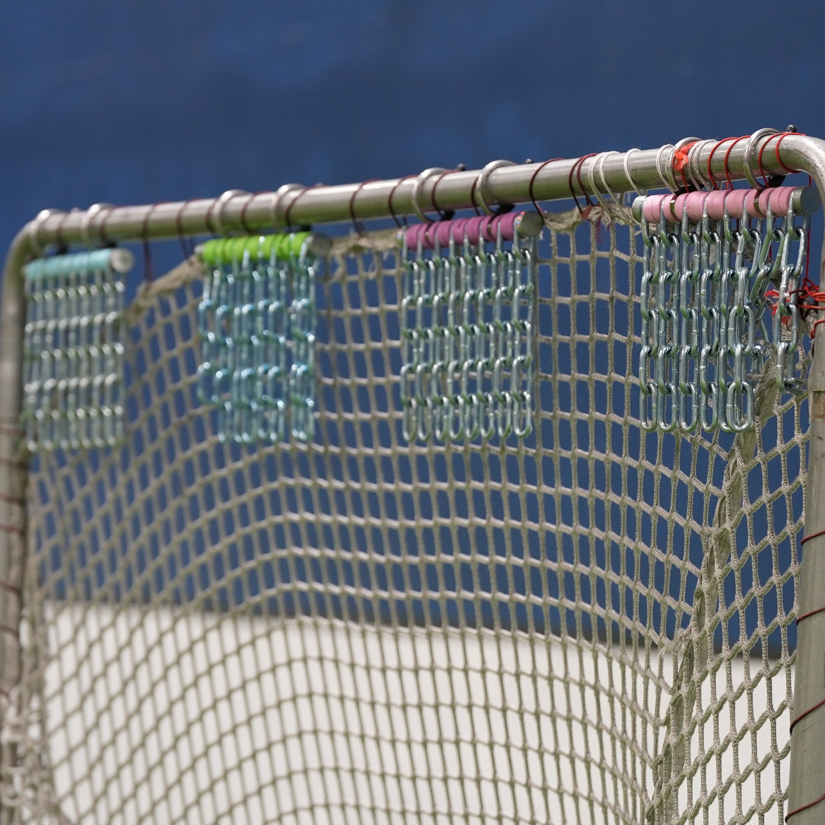 4 Cheddy Chains Hanging on a Lacrosse Goal